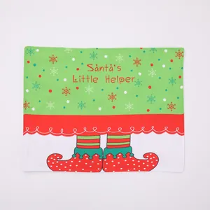 Christmas place mat featuring Santa's Little Helper elf design in green and red