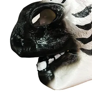 Macro view of zebra latex mask showing detailed black and white fur texture and teeth