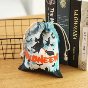 Halloween drawstring candy bag with witch and bat patterns on blue starry background
