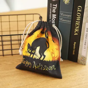 Halloween drawstring candy bag featuring black cat and bat prints on orange moon background