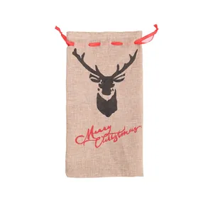Burlap Christmas wine bottle bag featuring a reindeer head silhouette and red drawstrings