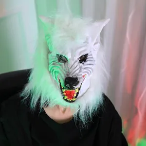 Detailed view of scary white werewolf mask with faux fur and sharp yellow teeth