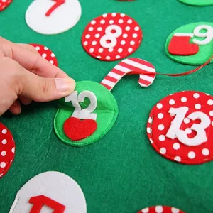 Green felt Christmas advent calendar with numbered pockets and festive decorations