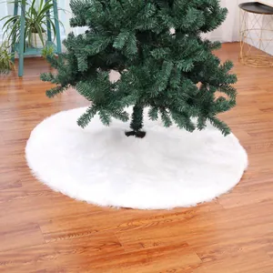 Detailed view of 122cm white plush Christmas tree skirt on warm wooden floor