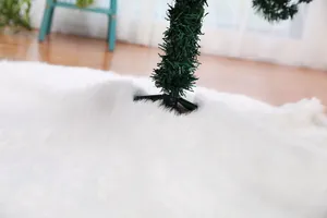 Close-up of a 122cm white faux fur Christmas tree skirt showing soft plush texture