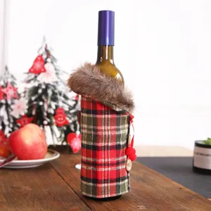 Christmas wine bottle cover with red and green plaid pattern and faux fur collar