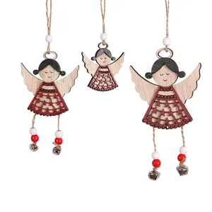Three Nordic wooden angel ornaments with metal bells and rope hangers for Christmas trees