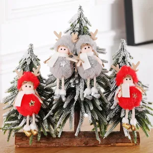 Handmade plush reindeer Christmas doll ornaments hanging on snowy trees decoration