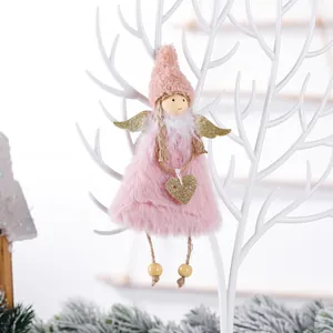 Pink plush Christmas angel ornament with gold wings and sequin heart on white branch