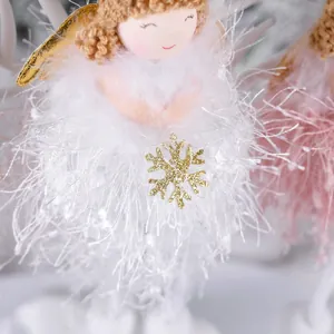 Handmade white plush Christmas angel ornament with golden wings and snowflake detail