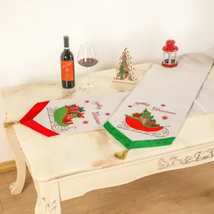 Kerst tafelrunner van linnen met Merry Christmas print en feestelijke gouden kwastjes