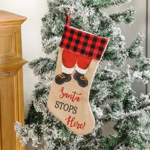 Hanging Buffalo plaid Santa Christmas stocking with Santa STOPS Here print for holiday decor