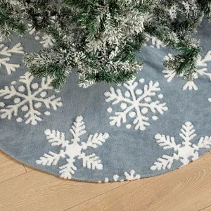 Blue plush Christmas tree skirt with white snowflakes on wood floor, 122cm festive decor
