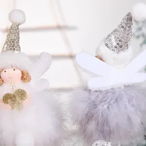 Detail of plush angel Christmas tree ornaments with white feathers and sequin hats