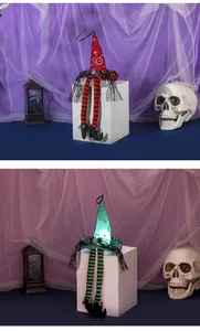 Close-up of glowing Halloween wizard hats with striped legs and LED lights in two colors