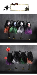 Detailed view of four Halloween ghost doll pendants with spider web dresses and bells