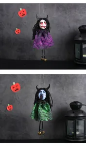 Close-up of Halloween ghost dolls with purple and green spiderweb skirts and gold bells
