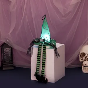 Light-up Halloween witch hat hanging ornament with long striped legs and green sequins