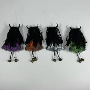 Detail of four colorful Halloween witch ornaments with spider web skirts and bells
