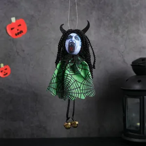 Creepy Halloween ghost hanging decor with blue face, green cloak, and brass bells