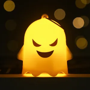 Cute Halloween ghost night light with warm yellow glow and hanging loop for party decor