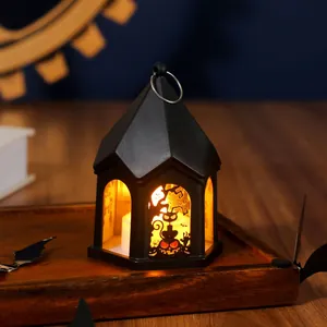 Halloween vintage lantern with black cat and pumpkin silhouette and warm LED candle light