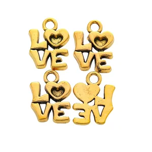 Set of 4 vintage gold alloy LOVE heart pendants for DIY jewelry making and crafts
