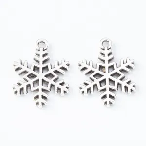 Vintage silver snowflake pendant pair in antique alloy for DIY Christmas jewelry making