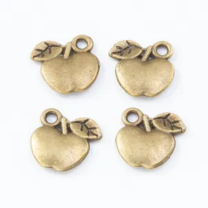 Set of four vintage bronze apple charms with leaf details for DIY jewelry making