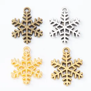 Set of four snowflake alloy pendants in various metal finishes for DIY jewelry making