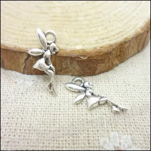 Macro detail of retro alloy fairy charms with wings and vintage silver finish for DIY jewelry