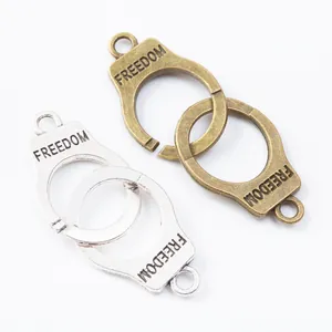 Antique silver and bronze freedom handcuff pendants for DIY jewelry making