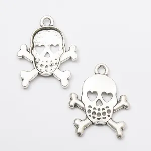 Vintage silver skull crossbone charms with heart shaped eyes and hanging rings