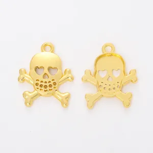 Detailed macro view of gold skull pendants with heart-shaped eyes for DIY jewelry