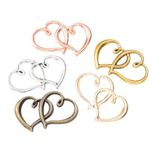 Pendentifs vintage double cœur en cinq finitions métalliques pour la création bijoux
