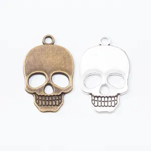 Retro zinc alloy skull charms in silver and bronze finish for DIY jewelry making