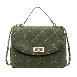 Quilted olive green suede handbag for women featuring a gold turn-lock and chain strap