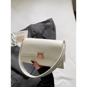 Minimalist cream white French baguette bag with golden buckle and sleek leather texture