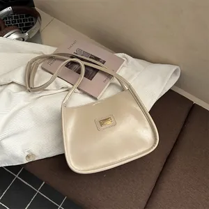 Elegant cream faux leather shoulder bag in a retro square design for daily commuting
