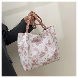 White butterfly print tote bag with pink woven handles for women in business casual style