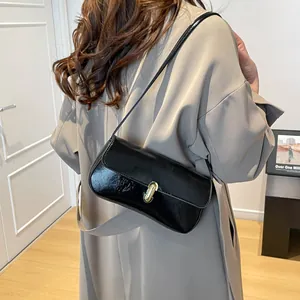 French retro black glossy leather underarm bag with gold metal buckle for women