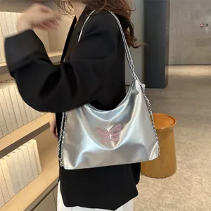 Silver metallic Y2K shoulder bag with pink butterfly embroidery and metal chain strap