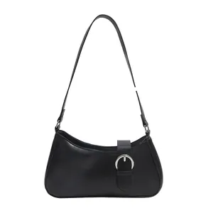Minimalist black crescent shoulder bag with round silver buckle and leather strap