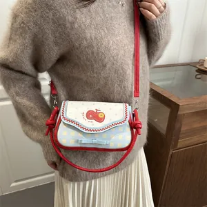 Women's cute plaid shoulder bag featuring apple embroidery and red handle accents