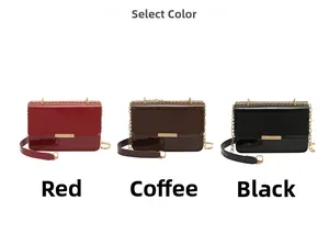 Detailed view of women's patent leather bags in red, coffee, and black with metal chains