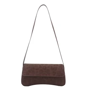 Brown leopard print baguette shoulder bag with matte texture and curved bottom design
