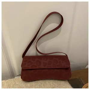 Chic burgundy leopard print baguette shoulder bag with stylish curved bottom design