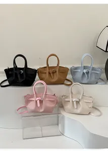 Collection of stylish woven texture bucket bags in five colors with top handles and straps