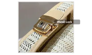 Close-up of the bright gold hardware lock and beige leather trim on a woven bag
