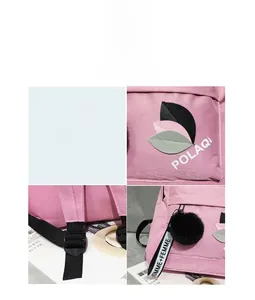 Detail of pink nylon backpack featuring leaf patchwork, logo embroidery, and plush pendant